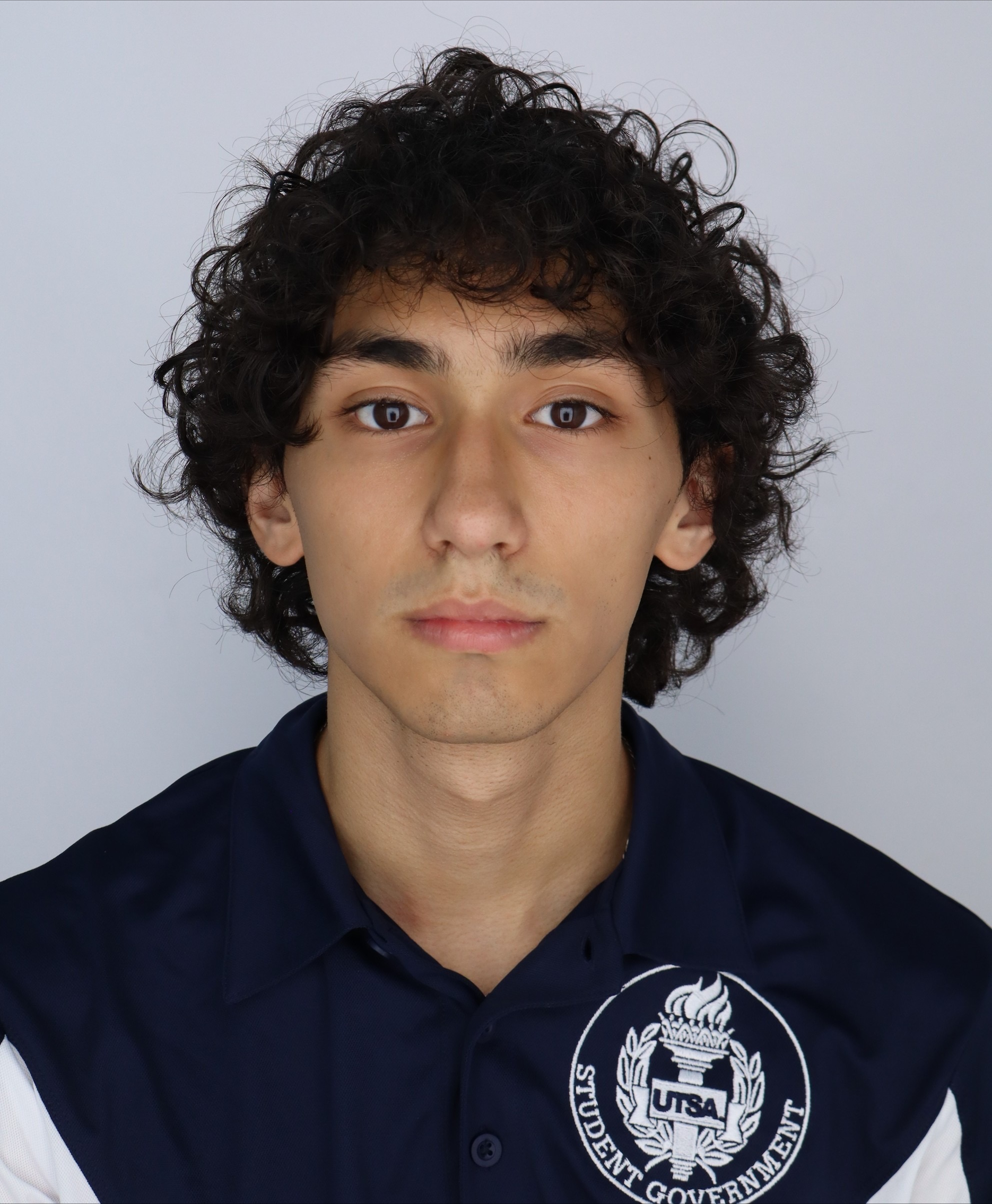 Diego Cuellar professional head shot photo with a grey background